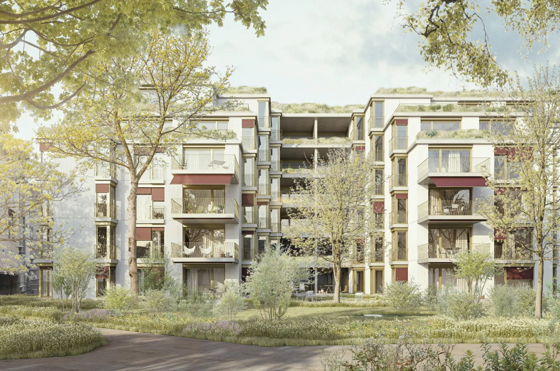 Grosse Grünfläche mit mehreren Gebäuden im Hintergrund