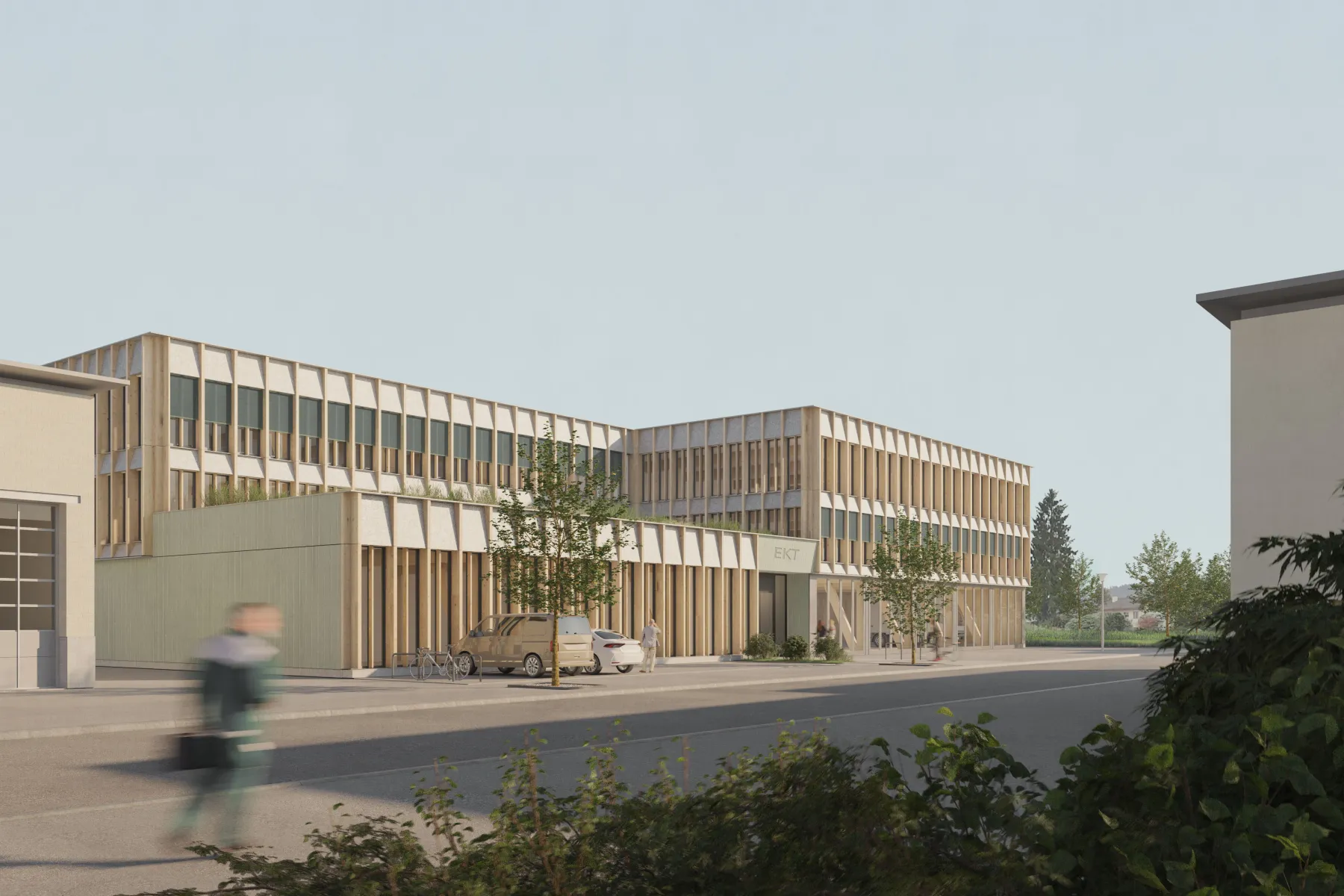 Gebäude mit Holzfassade und einigen Bäumen im Vordergrund