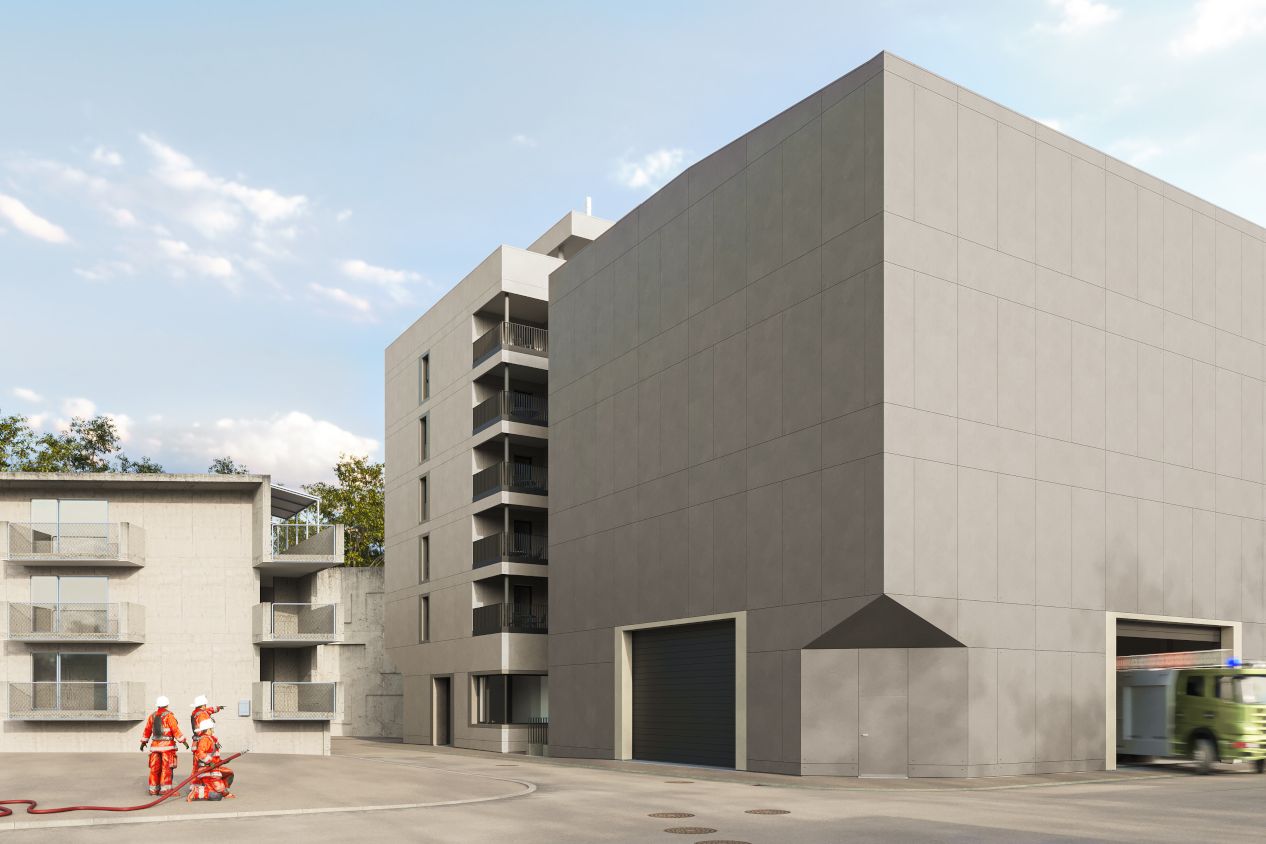 AZA Übungsanlage, Andelfingen Graues Gebäude mit Feuerwehrmänner