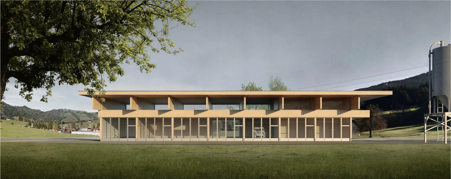 Gebäude mit Holzkonstruktion auf einer grünen Wiese