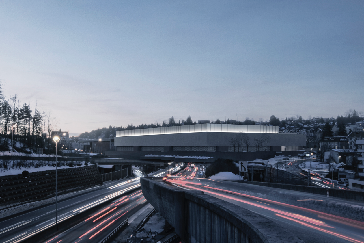 Autobahn bei Nacht mit Frontansicht der neugebauten Halle