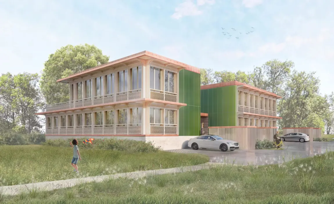 Haus auf Wiese mit vielen Fenstern